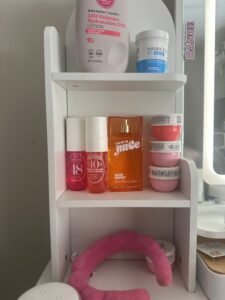 teenage shelf with perfumes and lotion.