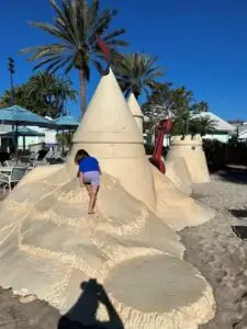 Child climbing on sand castle structure at Disney's Old Key West.