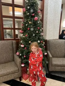 Child at hotel during Christmas season.
