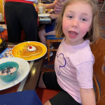 Child eat at Chef Mickey's at Disney World.