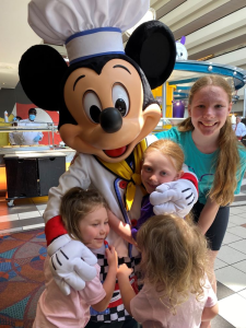 Children with Mickey at Chef Mickeys, Disney World.