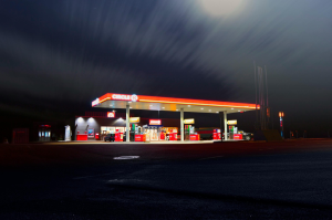 A brightly lit gas station in Norrtälje, Sweden, captured at night with a long exposure.