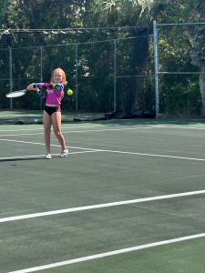 Child playing tennis at Disney's Vero Beach Resort. 