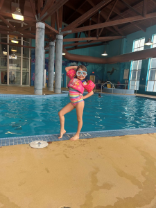Child ready to swim at hotel pool.