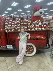 Child at Buc-ees by stuffed animal display
