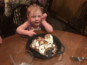 Child enjoying dessert at Disney World.